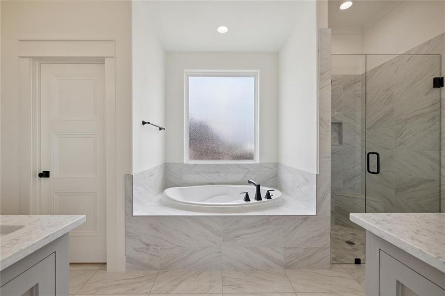 Bathroom with independent shower and bath and vanity