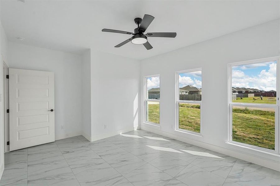 Spare room with ceiling fan