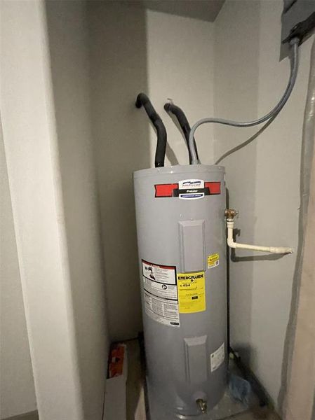 Hot water heater is in the garage for easy access