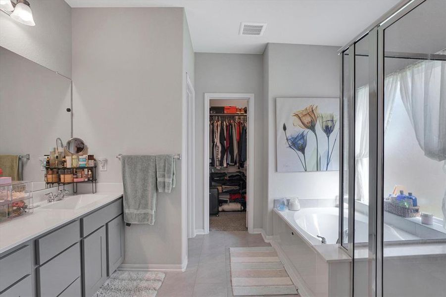 Ensuite Master Bath with Dual Vanities and Soaking Tub.