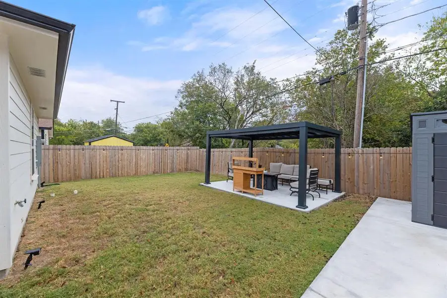 View of yard with a patio, an outdoor living space, and a gazebo