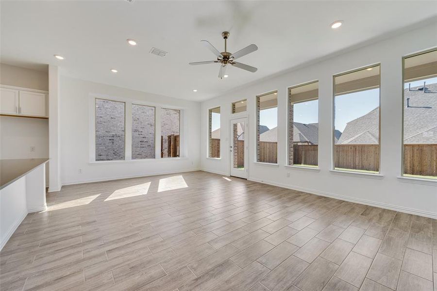 Unfurnished living room featuring light hardwood / wood-style floors and ceiling fan