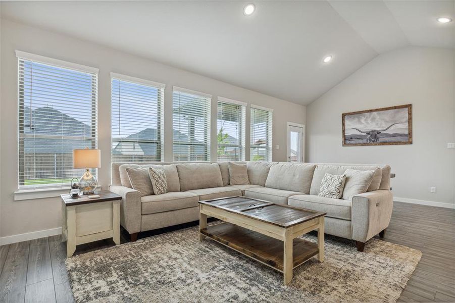 Living room overlooking the back yard with wonderful natural light!