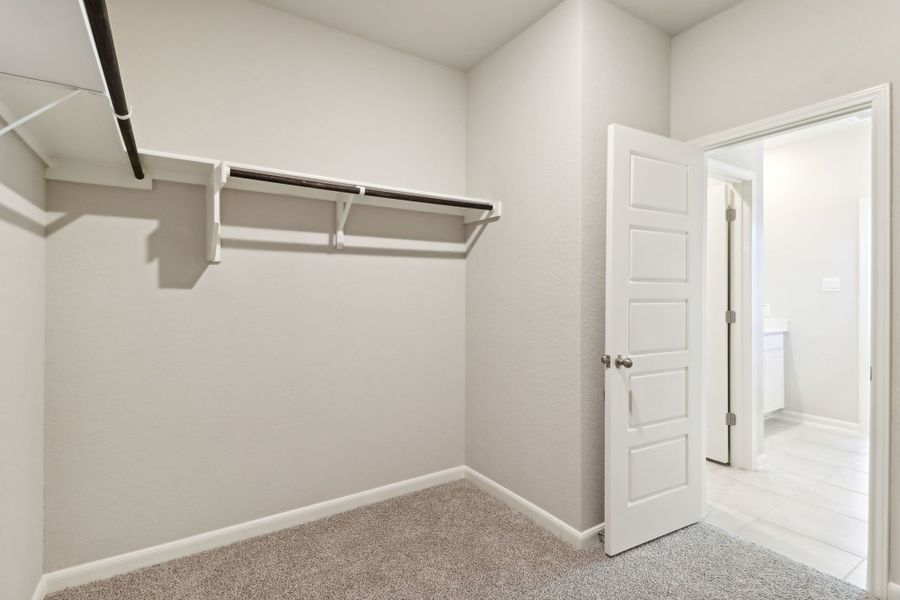 Primary suite walk-in closet in the Callaghan floorplan at a Meritage Homes community.