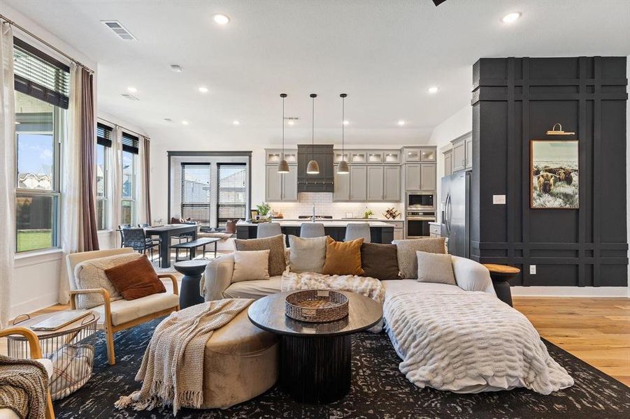 Living room featuring light wood-type flooring and sink