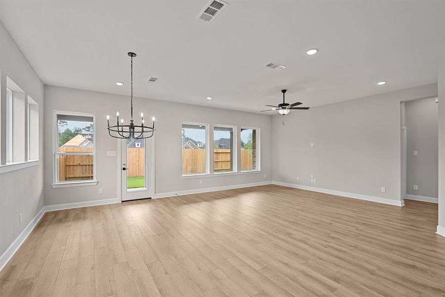 EXAMPLE PHOTO: Large open Living and Dining area with a wall of cabinets across rear of home!