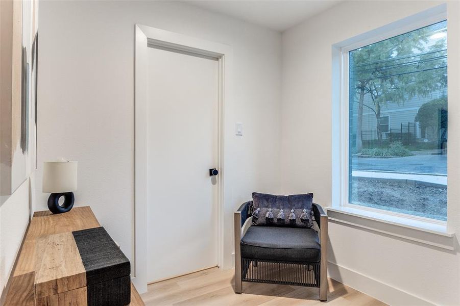 Sitting room with light hardwood / wood-style floors