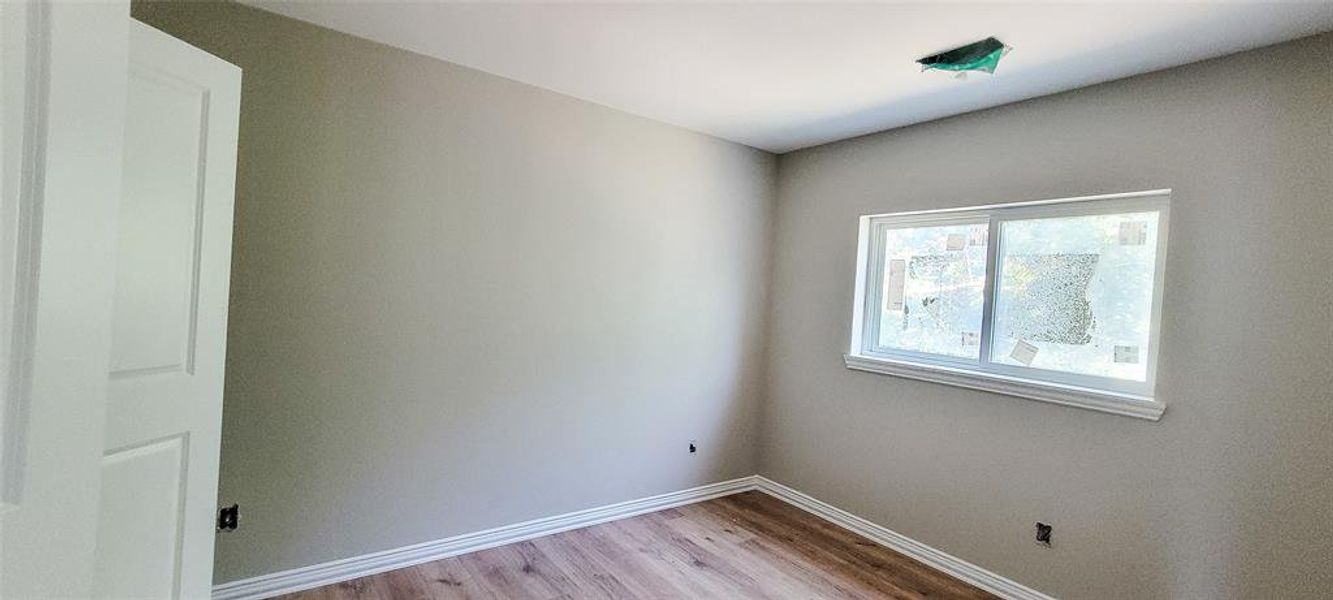 Spare room with light hardwood / wood-style floors