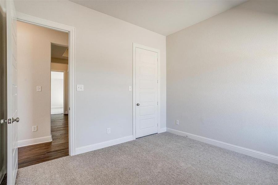 Unfurnished bedroom featuring carpet