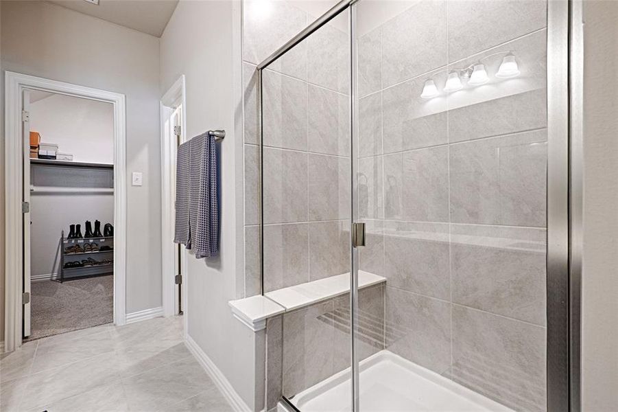 Primary bathroom with roomy shower and walk-in-closet