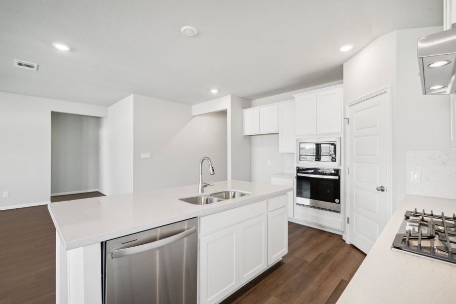 Kitchen in the Fitzhugh floorplan in a Meritage Homes community.