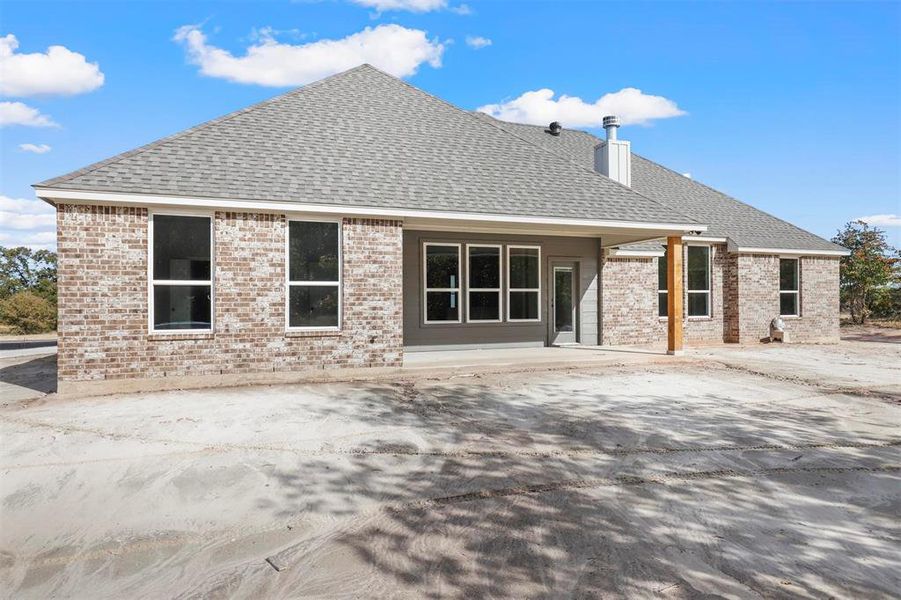 Rear view of house with a patio