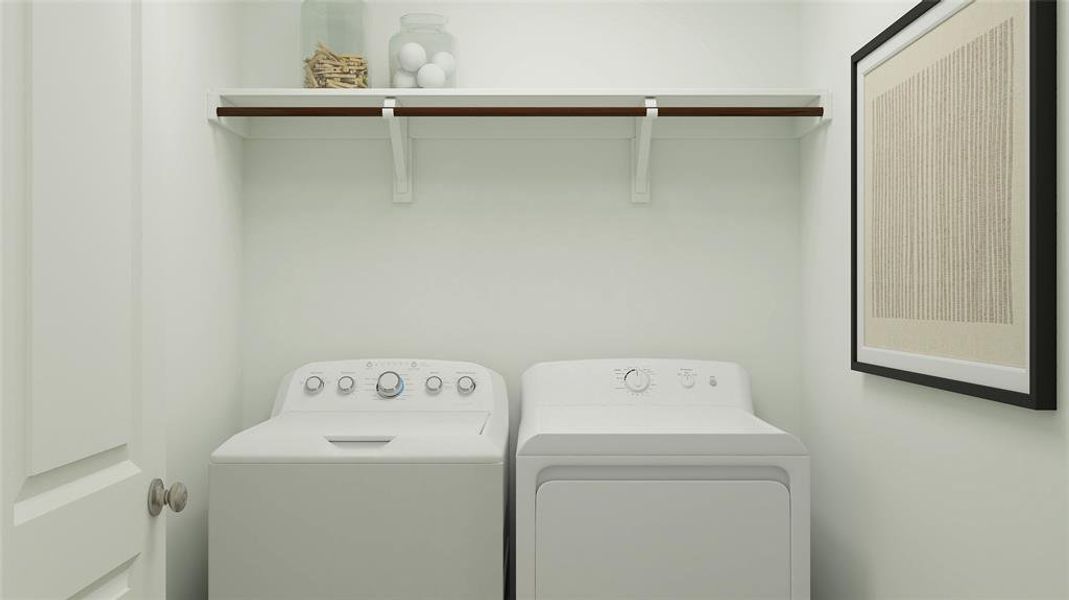 Laundry room with washing machine and clothes dryer