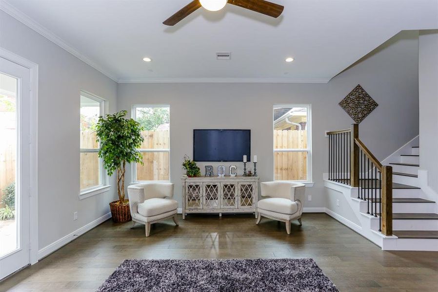 The ROCbrook's living room was designed to be both elegant and versatile, allowing for various furniture layouts to suit the homeowner's lifestyle. Rooms are virtually staged and the floor plan shown is from a similar home in another community. Actual layouts and furnishings may vary. Please visit the property for accurate details.