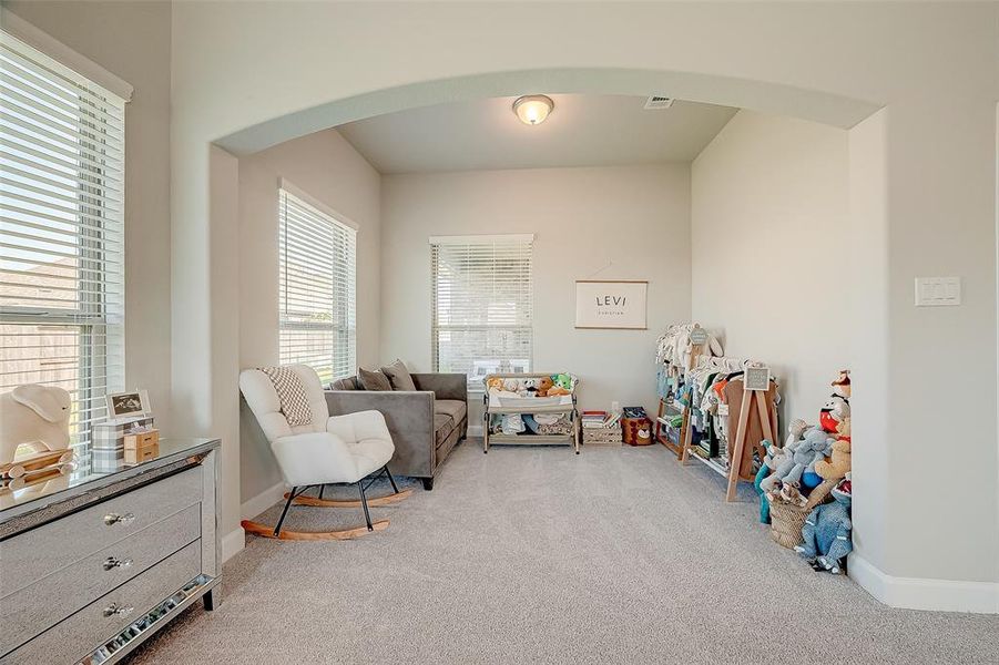 The primary bedroom has an additional sitting area.