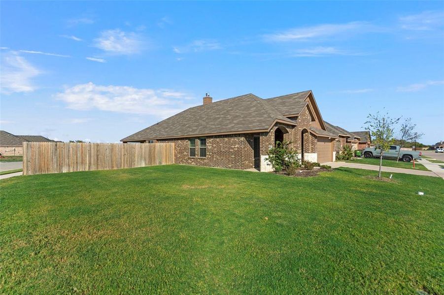 View of home's exterior featuring a yard