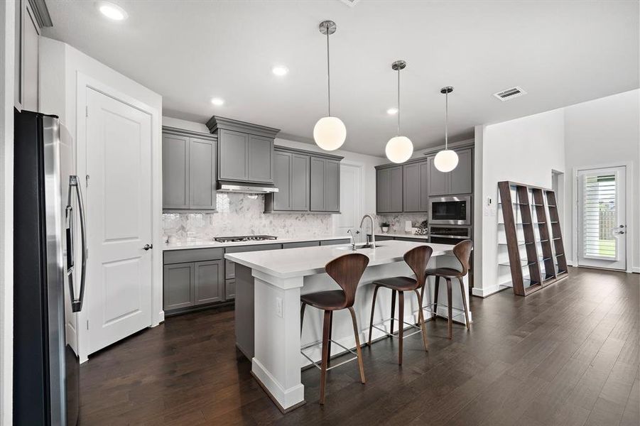 Walk-in pantry and tucked away laundry room.