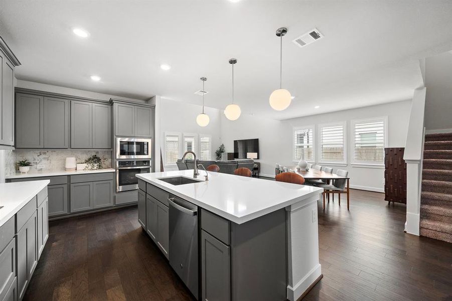 Quartz countertops and soft-close cabinets and drawers.