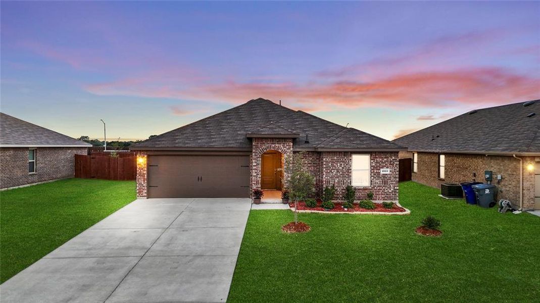 Evening view of this stunning newly built home