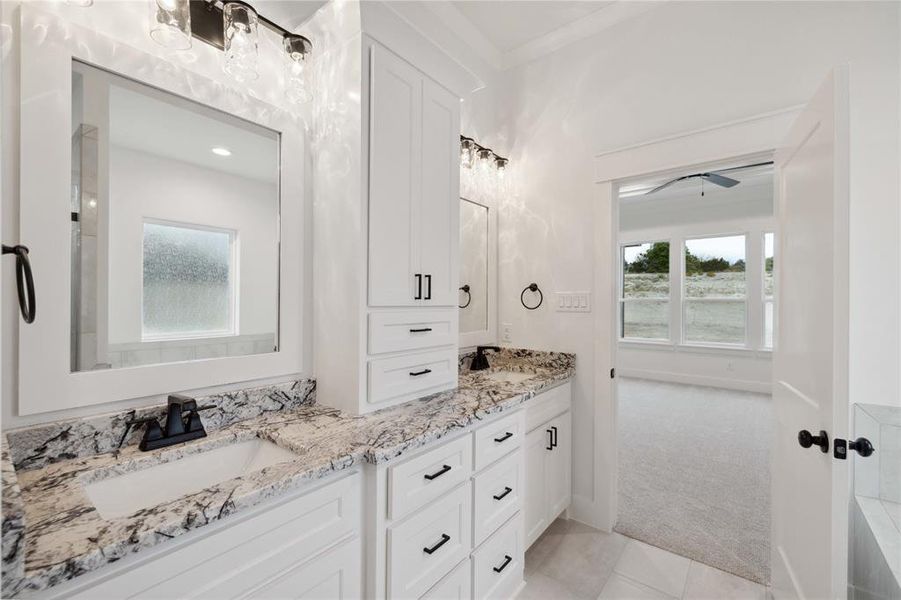 Bathroom with tile patterned floors and dual bowl vanity