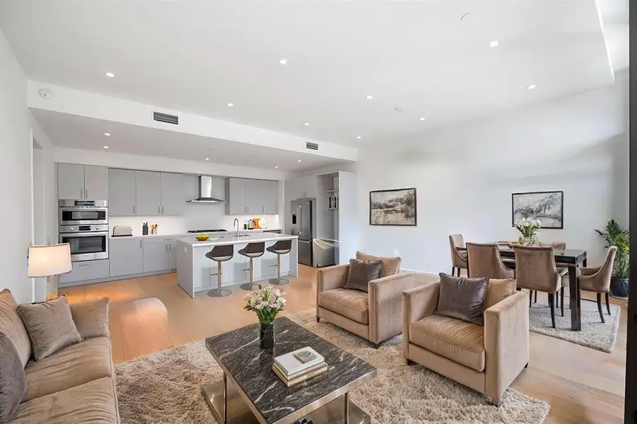 Open plan living, kitchen and dining with high ceilings and ample light from the south.