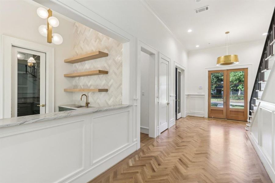 The wet bar is off of the main entry hall.