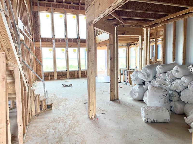 Open Formal Dining Overlooking the Wall of Windows