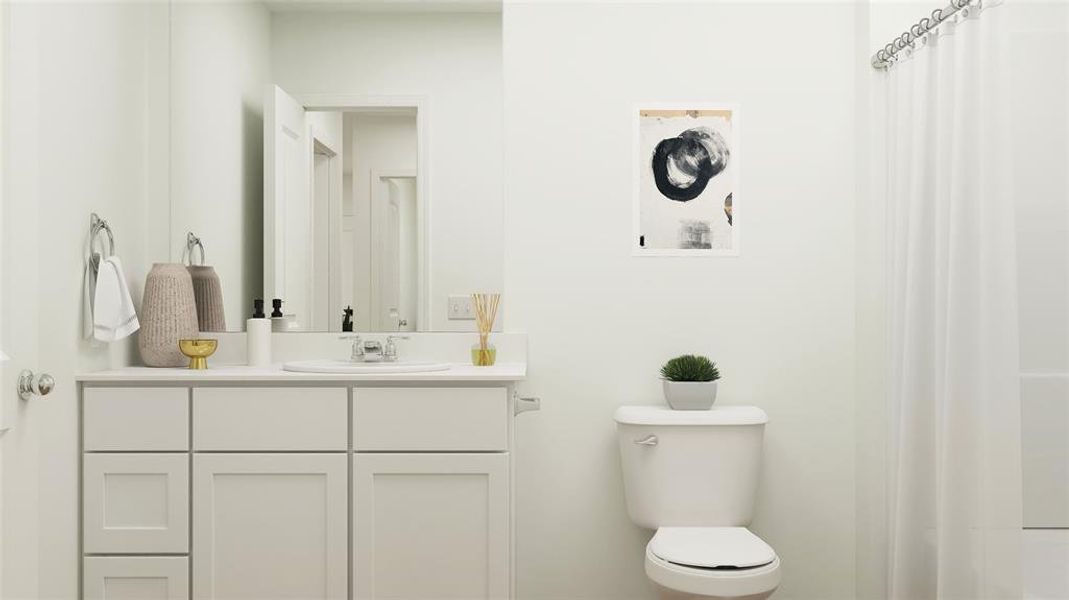 Bathroom with walk in shower, toilet, and vanity