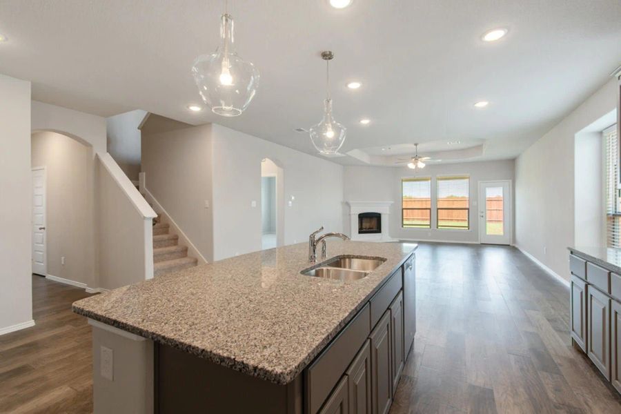 Kitchen to Family Room | Concept 2870 at Silo Mills - Select Series in Joshua, TX by Landsea Homes