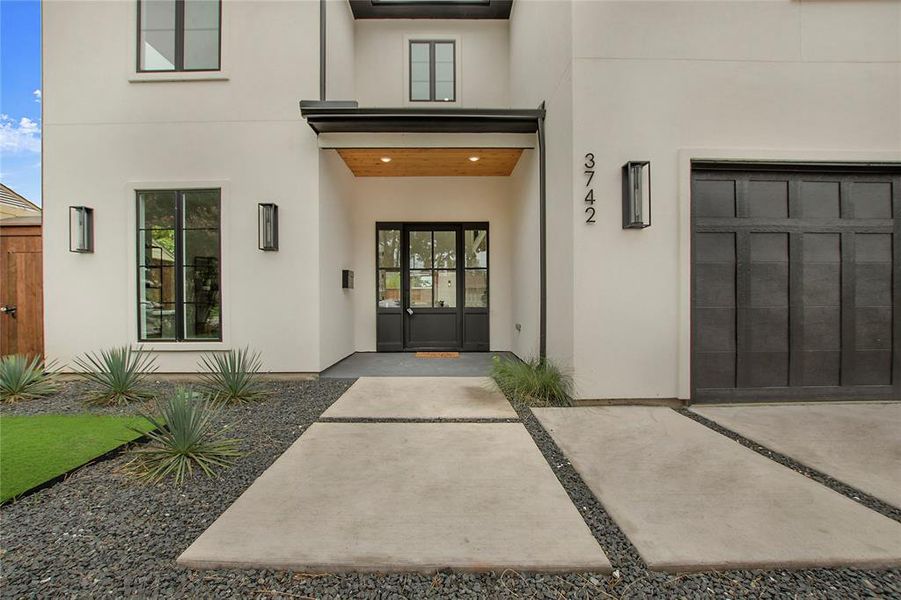 Entrance to property featuring a garage