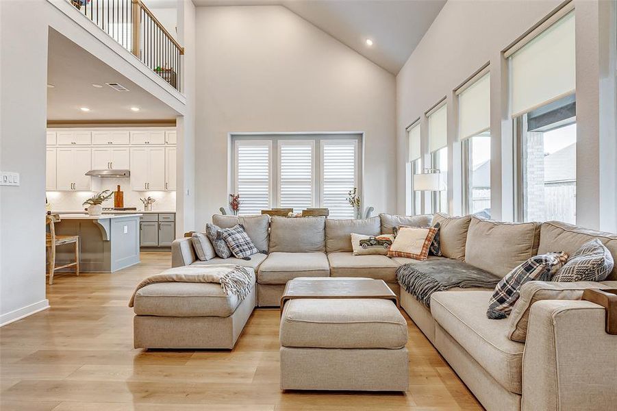 This home is equipped with custom motorized shades and Plantation Shutters throughout.