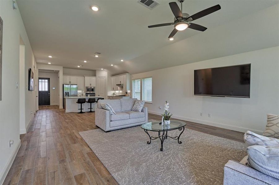 Large family room connected to the dining and kitchen make for great entertaining