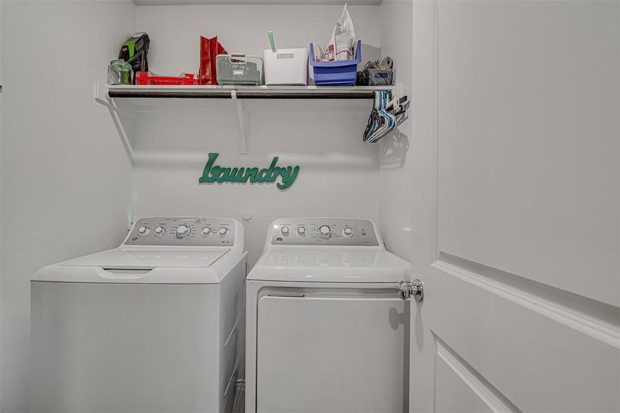 Laundry room with washing machine and dryer