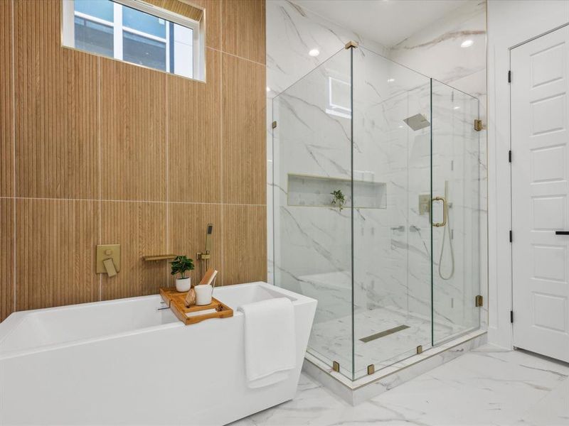 Bathroom featuring tile floors, wooden walls, and plus walk in shower