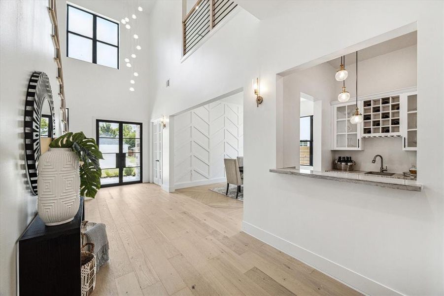 Another view of the office entry, dining room and wet bar