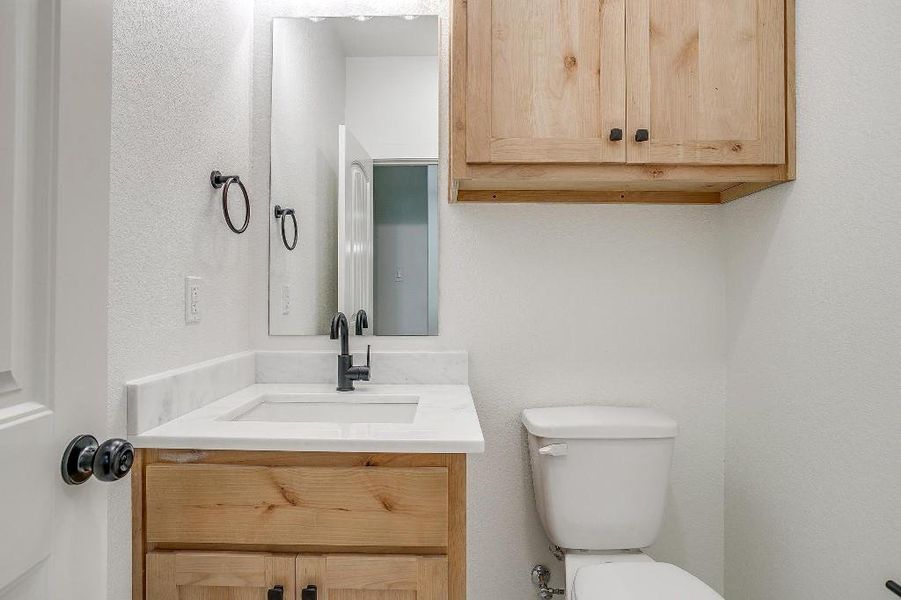 Bathroom with vanity and toilet