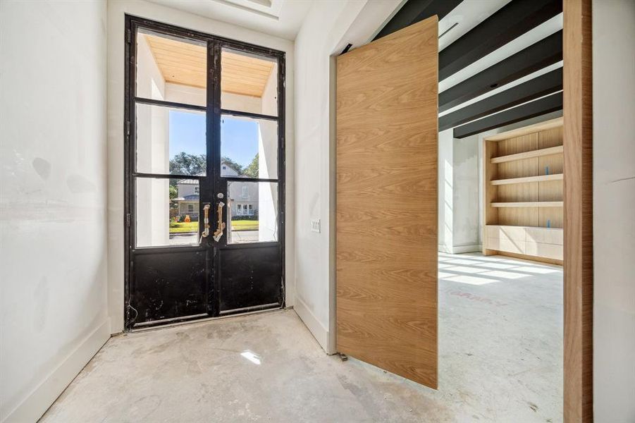 Entrance of the home with a double steel front door.  Construction as of October 20th, 2024.