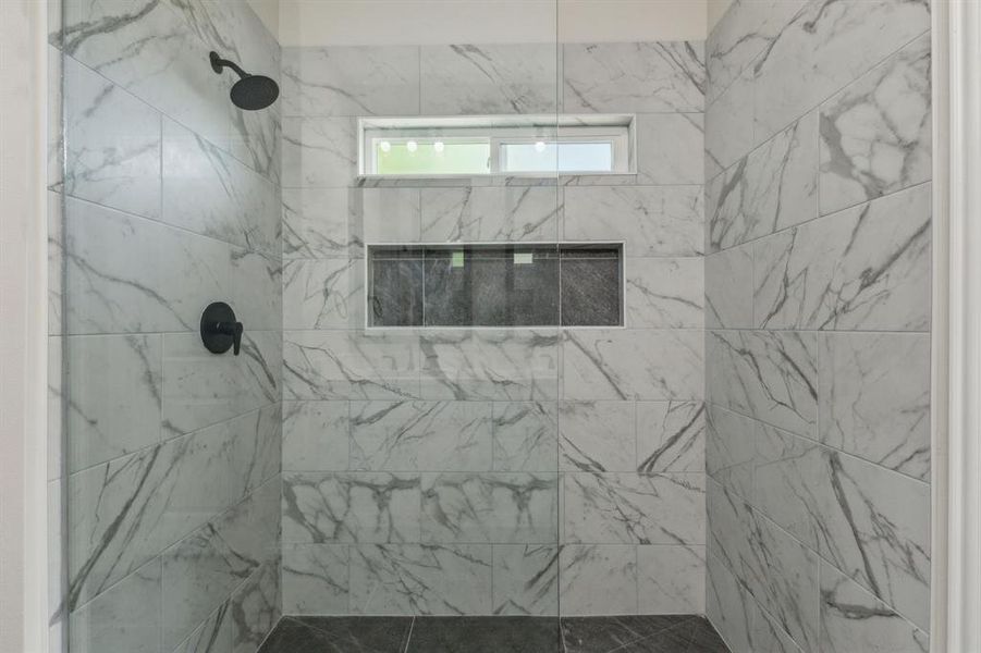 Bathroom with tiled shower