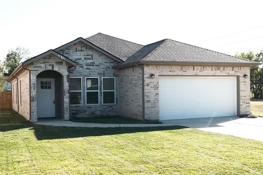 View of front of house and front lawn.