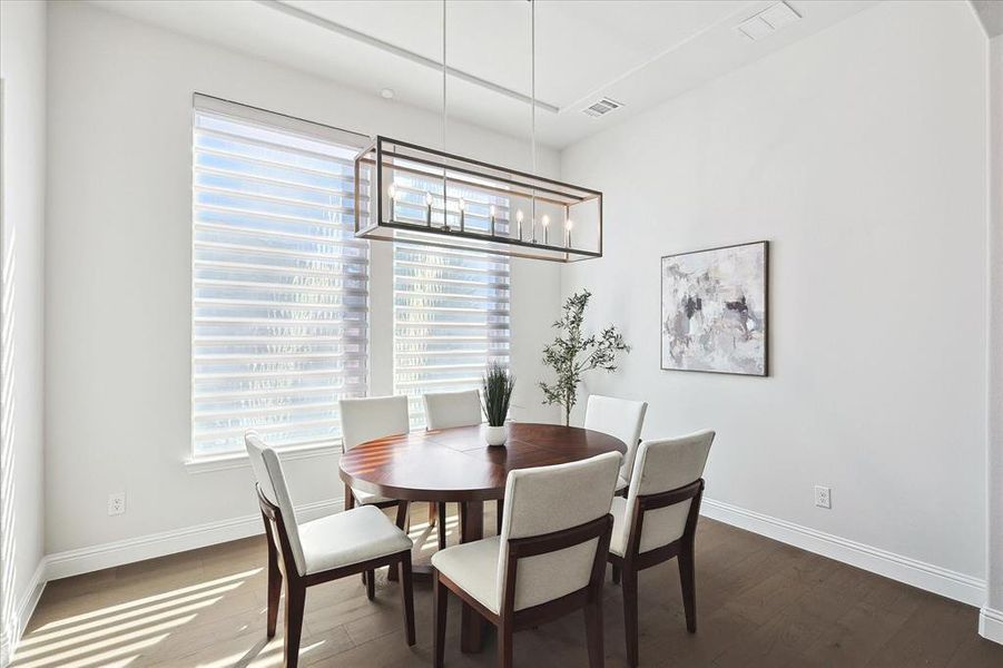 Dining space featuring dark wood-type flooring