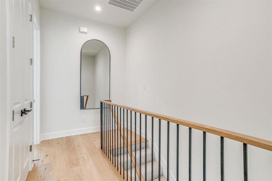 Upstairs landing featuring convenient laundry facilities, seamlessly blending practicality with modern design.