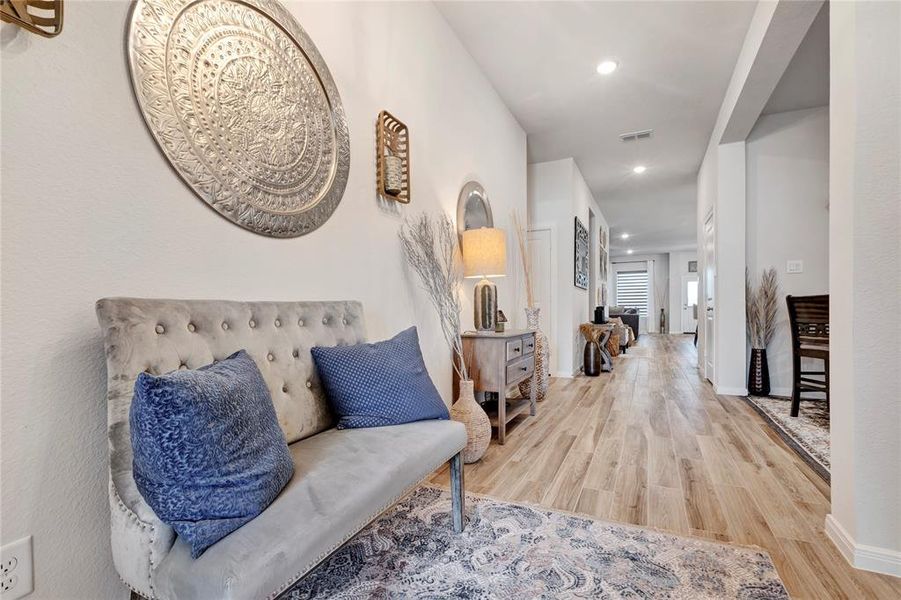 Elegant Foyer - Spacious foyer/hallway with beautiful floors, demonstrating the meticulous care and attention to detail throughout the home.