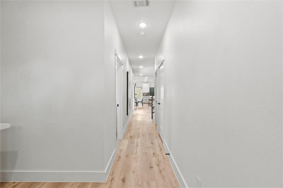 Hallway with light wood-type flooring