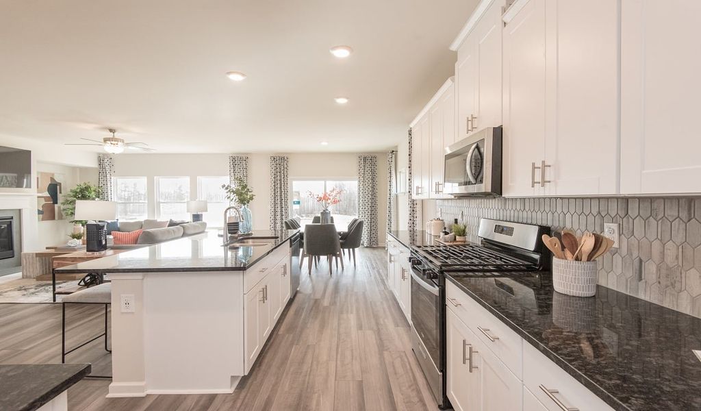 Cook dinner while the kids do homework at the spacious kitchen island.