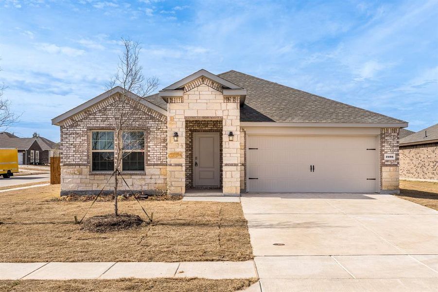 View of front of property with a garage