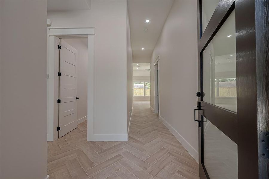 As soon as you walk in you're greeting with a beautiful herringbone tile floor.