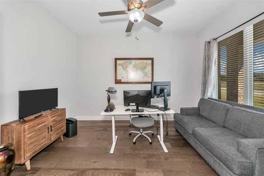 Office area featuring ceiling fan and wood-type flooring