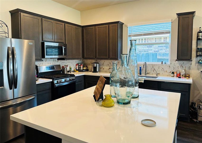 Kitchen open to dining and living room