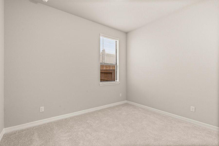 Fourth bedroom with private bath. Note: Sample product photo - actual exterior and interior selections may vary.