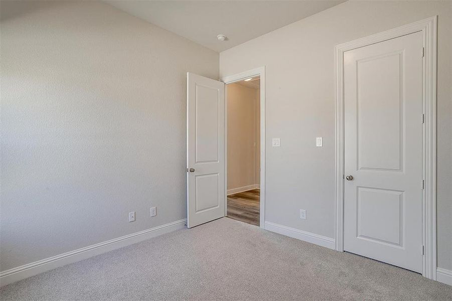 Unfurnished bedroom featuring carpet floors